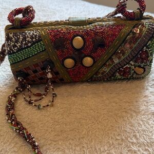 Unique Mary Frances handbag with shoulder strap.